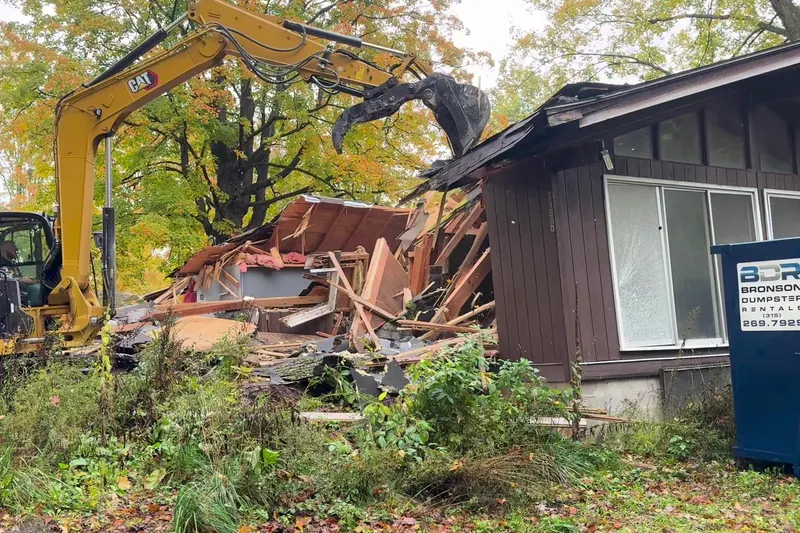 Gable wall of a house coming down during demolition